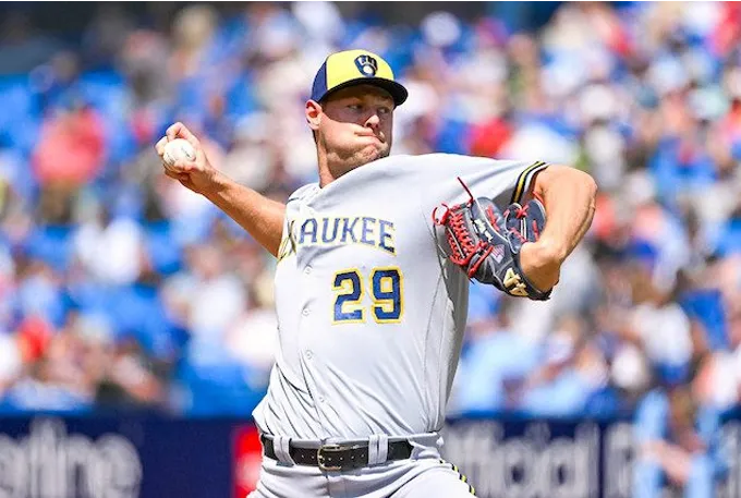 A baseball player in action, skillfully throwing a ball during a competitive game on the field.