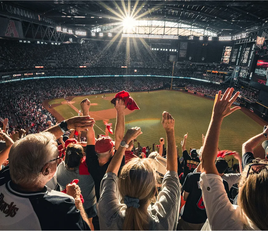 A lively crowd of spectators enjoying a baseball game, filled with excitement and team spirit.