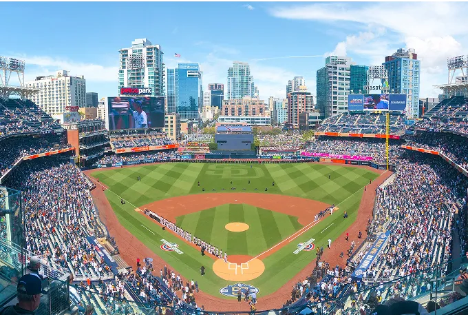 A panoramic view of a vibrant baseball stadium filled with enthusiastic fans and a well-maintained field.