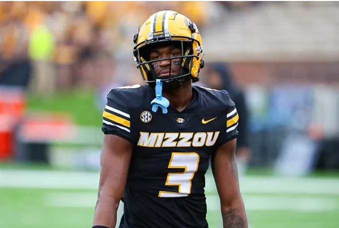 Missouri football player Josh Allen, a top-10 national prospect, showcasing his skills on the field during a game.