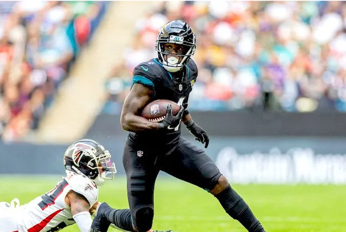 Jamaal Charles, running back for the Jacksonville Jaguars, in action on the football field during a game.