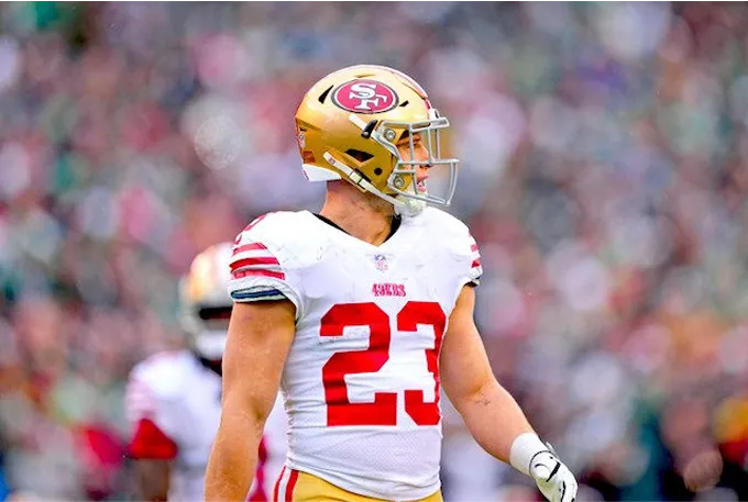 Image of Jimmy Garoppolo, quarterback for the 49ers, showcasing his athleticism and team spirit on the field.