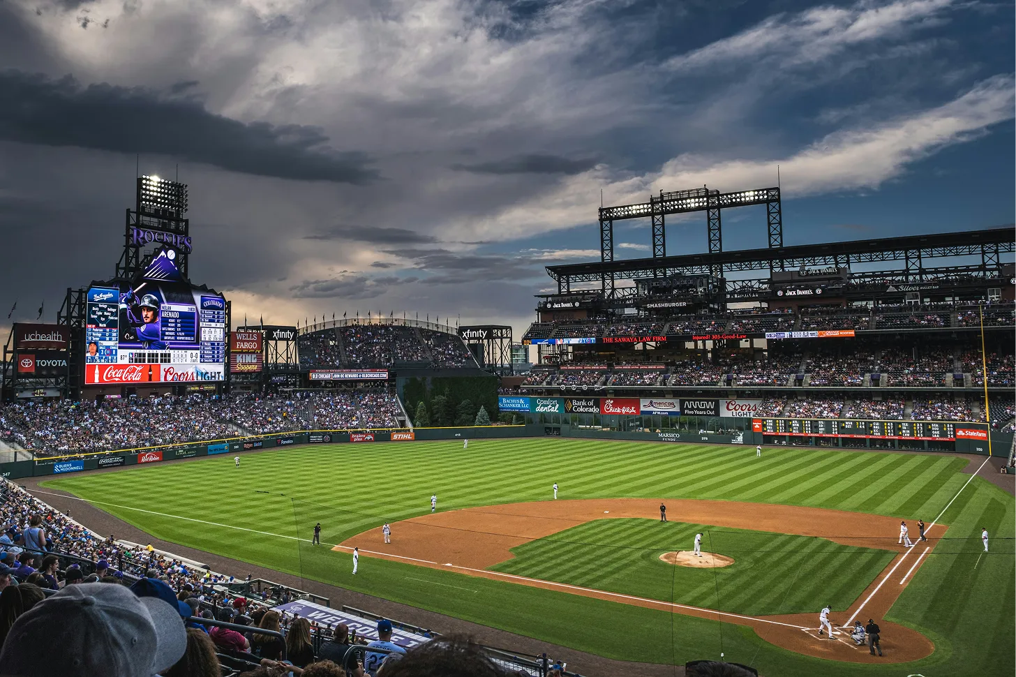 A lively baseball game in a stadium, with a large crowd enthusiastically watching the action on the field.